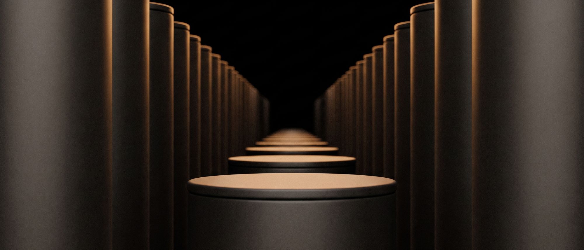 Abstract row of identical dark cylinders receding into black, each rimmed with a thin line of orange light